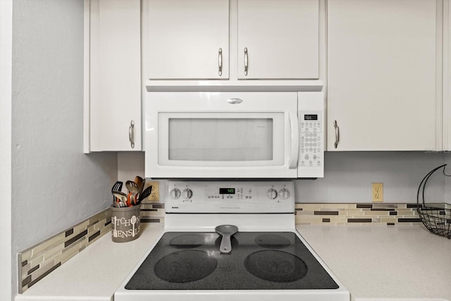 1631 W Dalary Pt Unit 1631, Crystal River, FL 34429 - kitchen featuring white appliances, tasteful backsplash, light countertops, and white cabinets