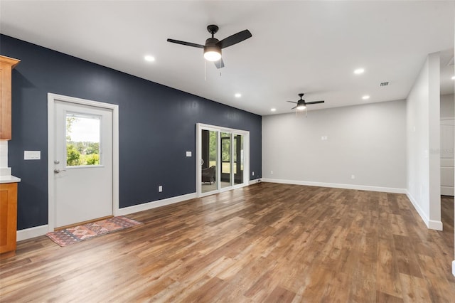 283 Riley Lake Dr, Hawthorne, FL 32640 - unfurnished living room featuring a ceiling fan, light wood finished floors, recessed lighting, and baseboards