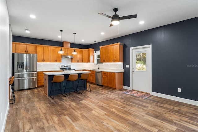 283 Riley Lake Dr, Hawthorne, FL 32640 - kitchen featuring stainless steel appliances, light countertops, dark wood finished floors, tasteful backsplash, and recessed lighting