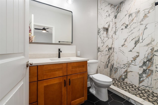 283 Riley Lake Dr, Hawthorne, FL 32640 - bathroom featuring vanity, a shower stall, toilet, a ceiling fan, and tile patterned floors