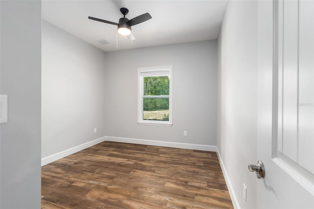 283 Riley Lake Dr, Hawthorne, FL 32640 - unfurnished room with dark wood-style flooring, baseboards, and a ceiling fan