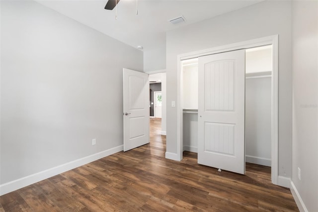 283 Riley Lake Dr, Hawthorne, FL 32640 - unfurnished bedroom with dark wood-style floors, baseboards, and a closet