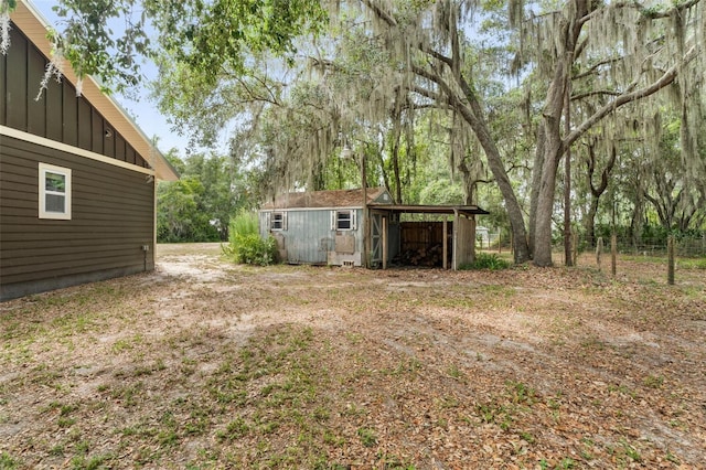 283 Riley Lake Dr, Hawthorne, FL 32640 - view of yard featuring an outdoor structure and a carport
