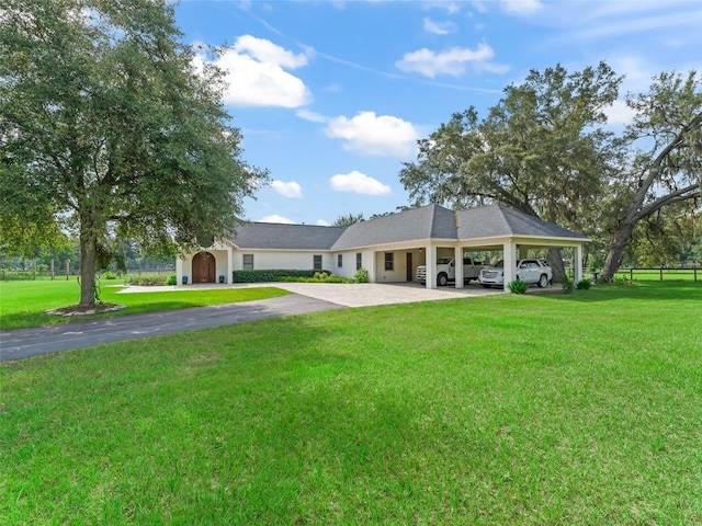 402 SW 127th Pl, Ocala, FL 34473 - view of property's community with a yard, driveway, and a carport