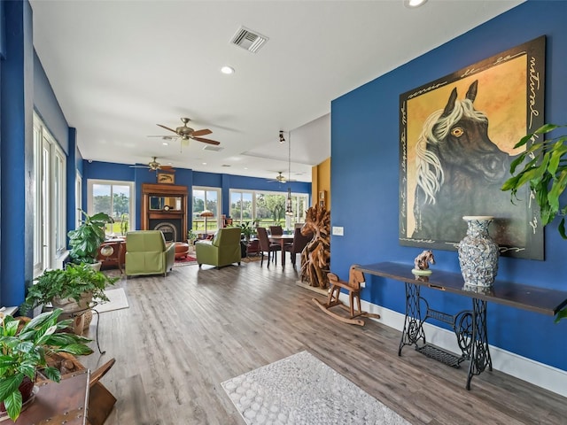 402 SW 127th Pl, Ocala, FL 34473 - sitting room with a ceiling fan, wood finished floors, recessed lighting, and baseboards