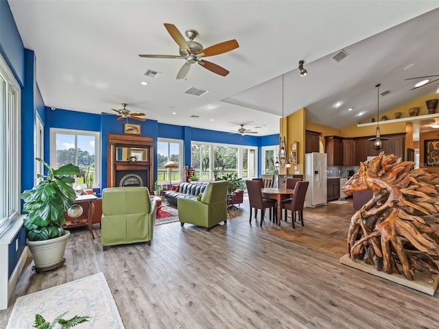 402 SW 127th Pl, Ocala, FL 34473 - living room featuring a ceiling fan, light wood-style flooring, and lofted ceiling