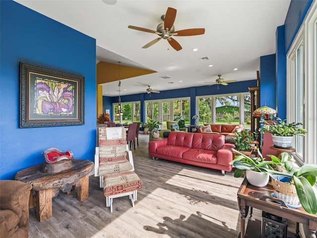 402 SW 127th Pl, Ocala, FL 34473 - living area with ceiling fan, wood finished floors, healthy amount of natural light, and recessed lighting