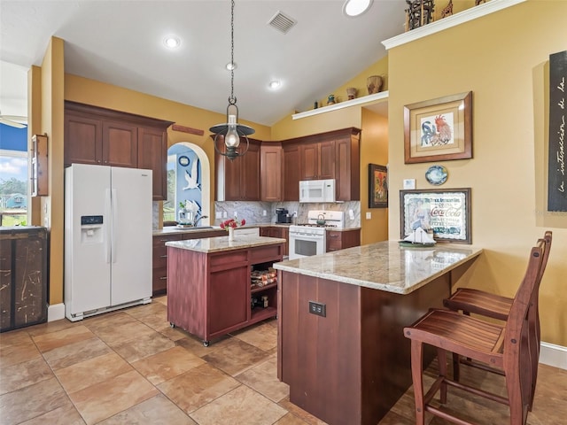 402 SW 127th Pl, Ocala, FL 34473 - kitchen with white appliances, decorative backsplash, open shelves, a peninsula, and lofted ceiling