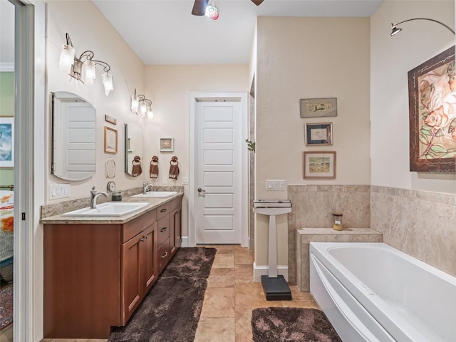 402 SW 127th Pl, Ocala, FL 34473 - bathroom featuring double vanity, a garden tub, a ceiling fan, and tile patterned flooring
