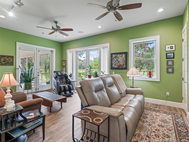 402 SW 127th Pl, Ocala, FL 34473 - living area with a ceiling fan, french doors, baseboards, wood finished floors, and recessed lighting