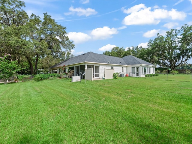 402 SW 127th Pl, Ocala, FL 34473 - rear view of property with a sunroom