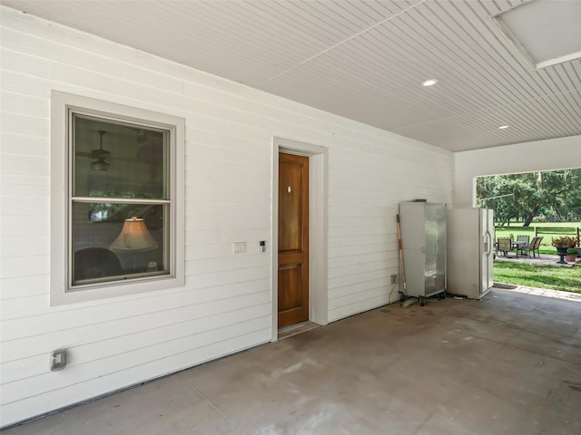 402 SW 127th Pl, Ocala, FL 34473 - garage with white refrigerator with ice dispenser