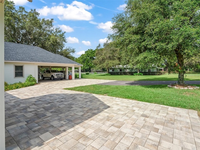 402 SW 127th Pl, Ocala, FL 34473 - view of patio / terrace with driveway and a carport