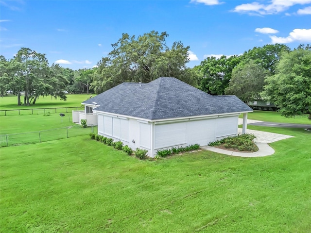 402 SW 127th Pl, Ocala, FL 34473 - view of property exterior featuring a shingled roof and view of wooded area