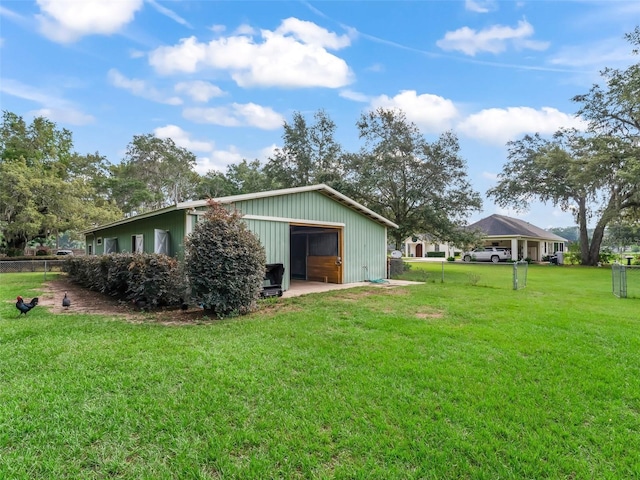 402 SW 127th Pl, Ocala, FL 34473 - view of yard with a detached garage, an outbuilding, and an outdoor structure