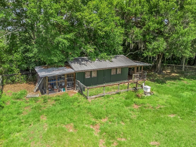 402 SW 127th Pl, Ocala, FL 34473 - rear view of house featuring metal roof