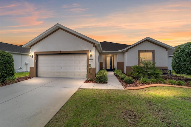 7263 SW 99th Cir, Ocala, FL 34481 - single story home featuring stucco siding, a garage, concrete driveway, and a lawn