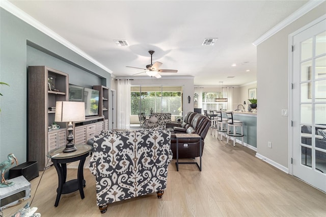 7263 SW 99th Cir, Ocala, FL 34481 - living area with ornamental molding, ceiling fan, wood finished floors, and baseboards