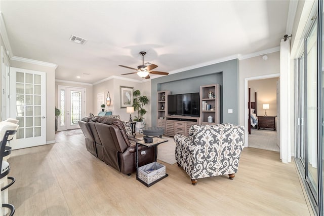 7263 SW 99th Cir, Ocala, FL 34481 - living room featuring light wood-style flooring, ornamental molding, a ceiling fan, and baseboards