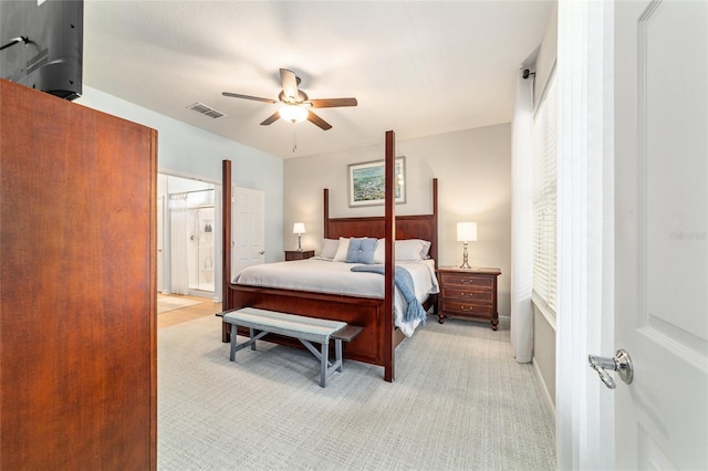 7263 SW 99th Cir, Ocala, FL 34481 - bedroom featuring light colored carpet, ceiling fan, and ensuite bathroom
