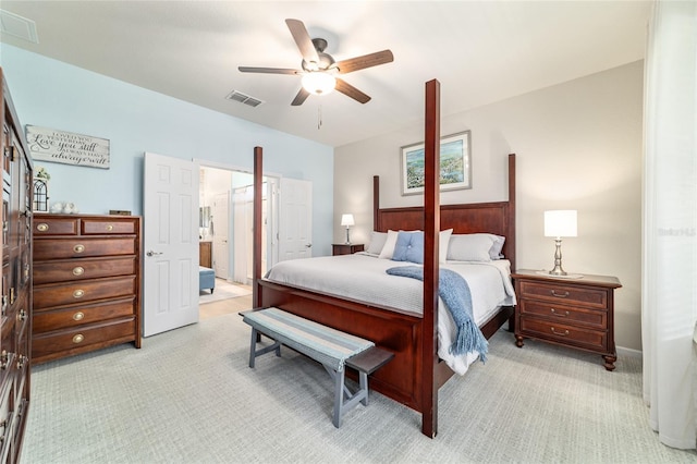 7263 SW 99th Cir, Ocala, FL 34481 - bedroom featuring light carpet, a ceiling fan, and ensuite bath