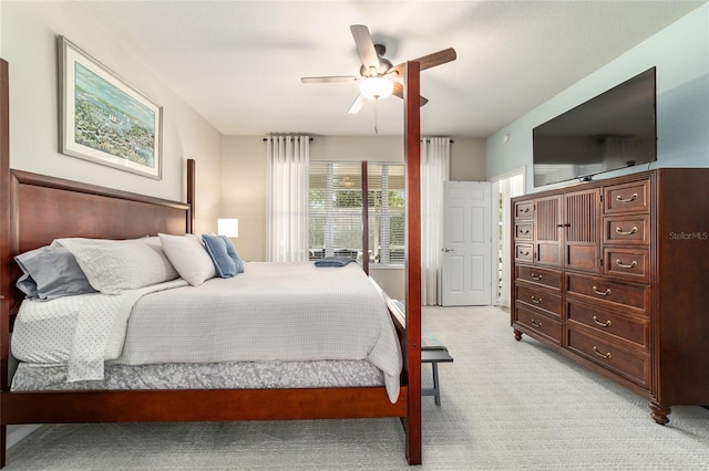 7263 SW 99th Cir, Ocala, FL 34481 - bedroom with light carpet and a ceiling fan