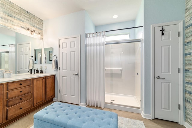 7263 SW 99th Cir, Ocala, FL 34481 - bathroom featuring vanity, a shower stall, and wood finished floors