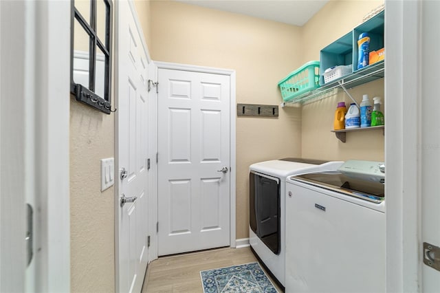 7263 SW 99th Cir, Ocala, FL 34481 - washroom with separate washer and dryer and light wood-style flooring