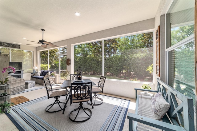 7263 SW 99th Cir, Ocala, FL 34481 - sunroom with healthy amount of natural light, a ceiling fan, and an outdoor living space with a fireplace