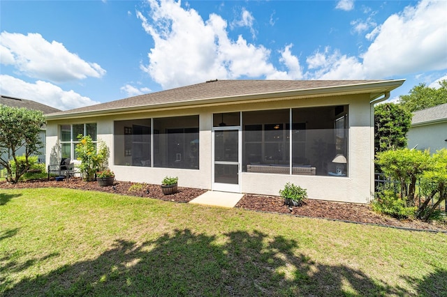 7263 SW 99th Cir, Ocala, FL 34481 - rear view of house featuring a sunroom, a yard, and stucco siding