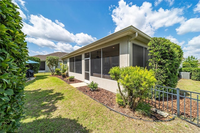 7263 SW 99th Cir, Ocala, FL 34481 - view of yard with a sunroom and central AC unit