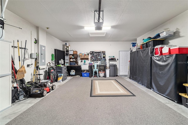 7263 SW 99th Cir, Ocala, FL 34481 - garage featuring electric panel and a garage door opener