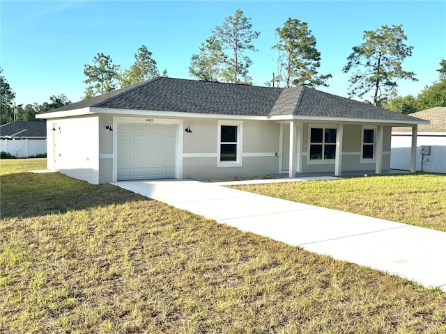 14425 SW 21st Pl, Ocala, FL 34481 - single story home with stucco siding, concrete driveway, a front yard, and a garage