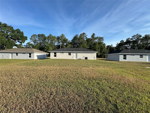 14425 SW 21st Pl, Ocala, FL 34481 - rear view of house featuring a lawn