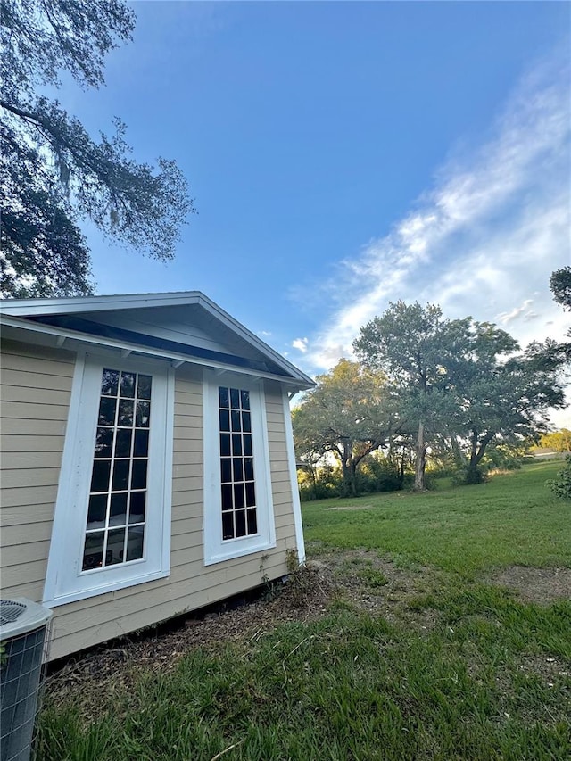 3005 NE 19th Ave, Ocala, FL 34479 - view of side of property featuring a lawn and central air condition unit