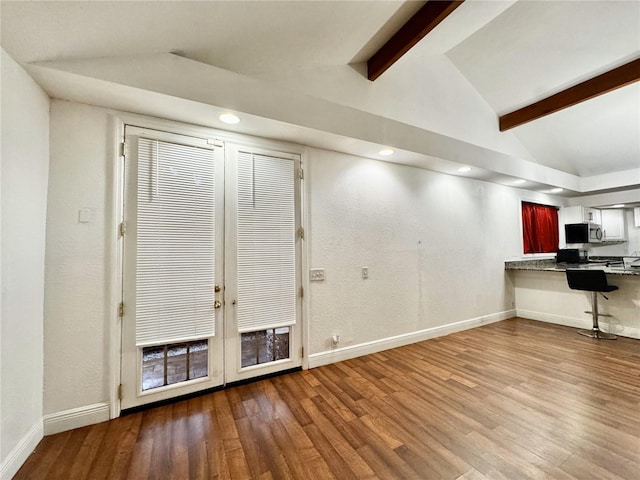 3005 NE 19th Ave, Ocala, FL 34479 - unfurnished living room featuring wood finished floors, baseboards, and recessed lighting