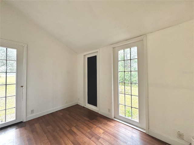 3005 NE 19th Ave, Ocala, FL 34479 - spare room with vaulted ceiling, wood finished floors, and baseboards