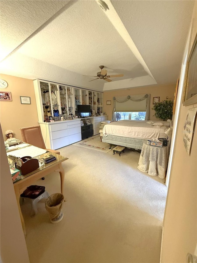 1001 NE 22nd Ave, Ocala, FL 34470 - bedroom featuring carpet flooring, ceiling fan, and a textured ceiling