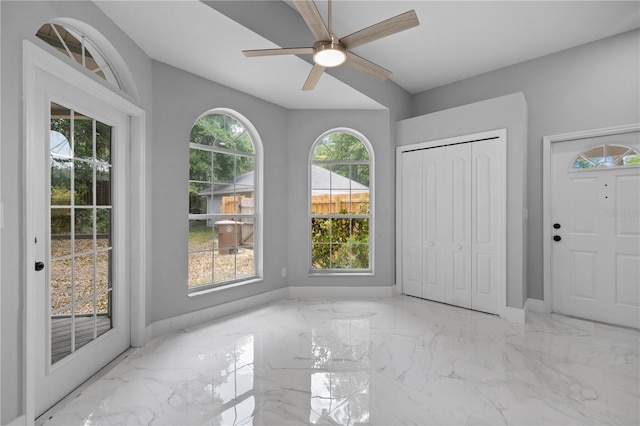 1628 SE 29th Ter, Ocala, FL 34471 - foyer featuring marble tiled floors, plenty of natural light, ceiling fan, and baseboards