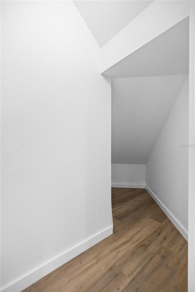 1628 SE 29th Ter, Ocala, FL 34471 - additional living space featuring vaulted ceiling, wood finished floors, and baseboards