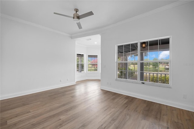 1628 SE 29th Ter, Ocala, FL 34471 - spare room featuring wood finished floors, baseboards, a ceiling fan, and ornamental molding