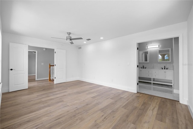 1628 SE 29th Ter, Ocala, FL 34471 - unfurnished bedroom featuring light wood finished floors, recessed lighting, baseboards, a sink, and connected bathroom