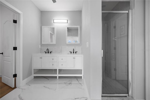 1628 SE 29th Ter, Ocala, FL 34471 - bathroom featuring double vanity, baseboards, a stall shower, and marble finish flooring