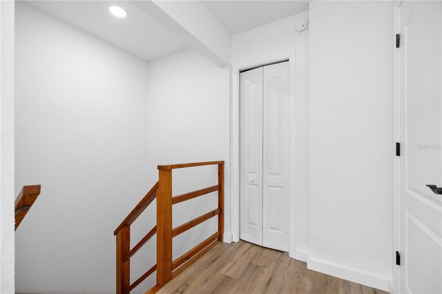 1628 SE 29th Ter, Ocala, FL 34471 - hall featuring wood finished floors, recessed lighting, an upstairs landing, and baseboards
