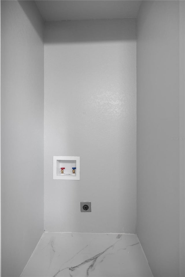 1628 SE 29th Ter, Ocala, FL 34471 - washroom featuring electric dryer hookup, marble finish floors, washer hookup, and baseboards