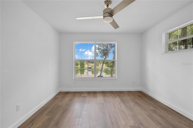 1628 SE 29th Ter, Ocala, FL 34471 - empty room featuring a ceiling fan, wood finished floors, and baseboards