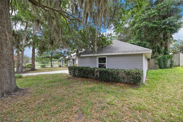 1628 SE 29th Ter, Ocala, FL 34471 - view of side of home with a shingled roof