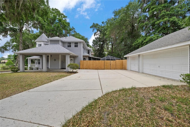 1628 SE 29th Ter, Ocala, FL 34471 - traditional-style house with covered porch, a garage, and a shingled roof