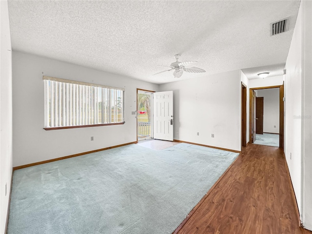 10520 SW 85th Ter, Ocala, FL 34481 - unfurnished room featuring ceiling fan, baseboards, a textured ceiling, and wood finished floors