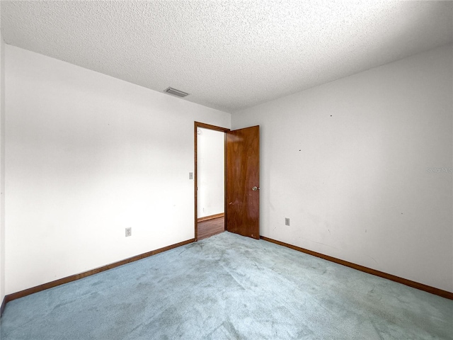 10520 SW 85th Ter, Ocala, FL 34481 - carpeted empty room with a textured ceiling and baseboards